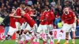 Manchester United's players celebrate as the winning penalty goes in to send them to the FA Cup final