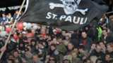 St Pauli fan waves a club flag