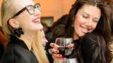 women drinking red wine