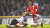 Nottingham Forest's Marcus Tudgay comforts a stricken Shaun Barker