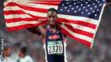 Michael Johnson holding the US flag