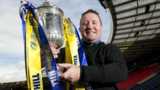 Hearts hero John Robertson poses with the Scottish Cup