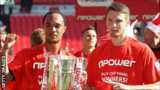 Byron Moore (l) and Nick Powell celebrate Crewe's League Two play-off final victory at Wembley in May