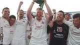 Lancashire captain Glen Chapple lifts the County Championship trophy