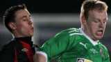 Paul Heatley of Crusaders and Cliftonville's George McMullan
