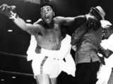 Cassius Clay shocks Sonny Liston