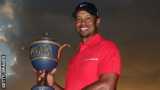 Tiger Woods with the World Golf Championships trophy