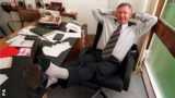 Sir Alex Ferguson at his desk