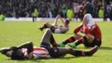 Brentford players after Marcello Trotta's penalty miss