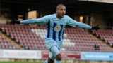 Leon Clarke celebrates another goal at a deserted Sixfields