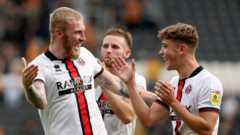 Blades win at Hull to return to top of Championship