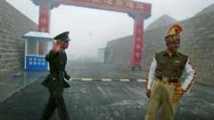 A Chinese soldier and an Indian soldier at their shared border in 2008