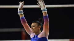 Gymnast Downie, 23, retires to protect mental health