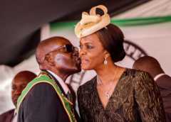 President Robert Mugabe kissing his wife and first lady Grace Mugabe during during the country"s 37th Independence Day celebrations at the National Sports Stadium in Harare