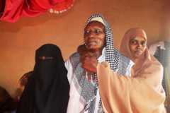 Old man with two women