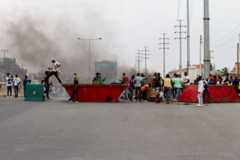 Protesters on skips in Luanda on Saturday