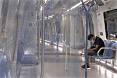 man travels in an almost empty Mass Rapid Train (MRT) on March 20, 2020 in Kuala Lumpur, Malaysia.