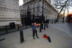 As Boris Johnson prepared to make his announcement, a lone violinist played on an empty Whitehall, near Downing Street