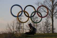 A man sits alone at the Olympic Park, Stratford, east London