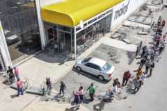 An aerial view of customers standing in a queue outside Makro in Soweto, Johannesburg on March 24, 2020.