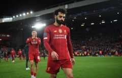 Liverpool players Mo Salah and Trent Alexander Arnold walk off the pitch at Anfield