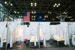 Hospital bed booths are set up at the Jacob K Javits Convention Center