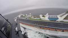 Helicopter flying towards the Grand Princess