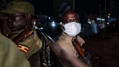 Uganda police officers patrol during a curfew in Kampala on April, 29, 2020.