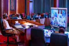 Buhari watches a video live stream of the launch