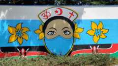 A wall painted with a masked woman at Arab Boys Mosque in Mombasa, Kenya