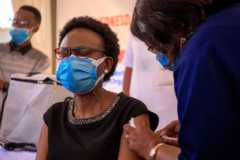 Health minister Jane Ruth Aceng receives an injection of the Oxford AstraZeneca Covid-19 vaccine in Kampala