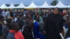 Mourners during the burial of Tanzania's President John Magufuli