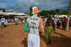 Supporters of former President Laurent Gbagbo gather as they wait for his visit to his home village of Mama - 27 June 2021