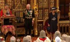 Prince Charles stands up following the conclusion of the speech