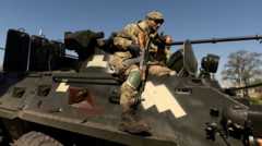 Украинский военный на бронемашине