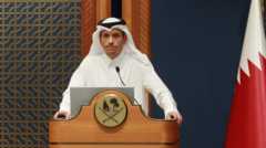 Sheikh Mohammed bin Abdulrahman al-Thani speaking at a podium