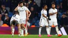 Leeds players look frustrated during the defeat to Liverpool