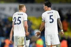 Rasmus Kristianse and Robin Koxh in discussion as Leeds concede a goal to Liverpool