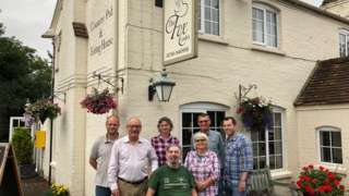 Action group outside the pub