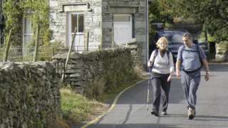 Two people walking in Grasmere