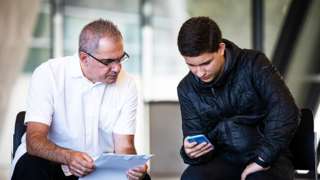 Diego Da Silva looks at his GCSE results with his father at Ark Evelyn Grace Academy, London.