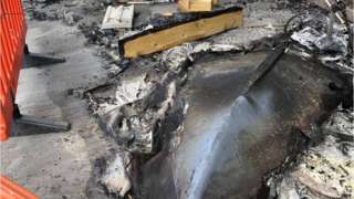 The fire-damaged boat