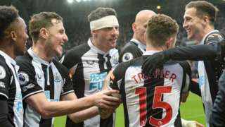 Newcastle players congratulate Kieran Trippier after his goal against Aston Villa