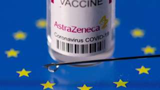 Vial labelled "AstraZeneca coronavirus disease (COVID-19) vaccine" placed on displayed EU flag is seen in this illustration picture