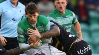 Simon Hammersley of Newcastle is tackled by Courtney Lawes of Northampton