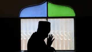 A man prays in a mosque during the Muslim festival of Eid al-Adha in the Kibera slum in Nairobi, Kenya, July 20, 2021.