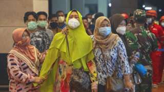 Relatives of people on Sriwijaya Air flight SJ 182 arrive at the crisis centre in Soekarno Hatta Airport, on 9 January 2021 in Jakarta, Indonesia