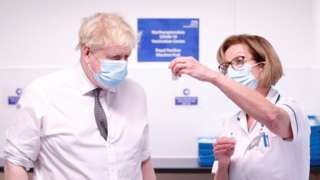 Boris Johnson with advanced pharmacy technician Jane Hosea at a vaccine centre in Northampton