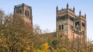 Autumnal trees lining the river below Durham Cathedral
