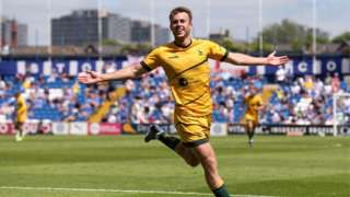Rhys Oates celebrates his winner at Stockport